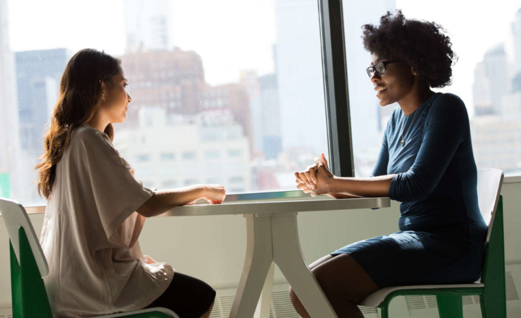 Two women at a business meeting.
